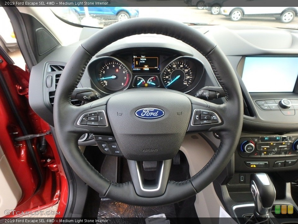 Medium Light Stone Interior Steering Wheel for the 2019 Ford Escape SEL 4WD #130957965
