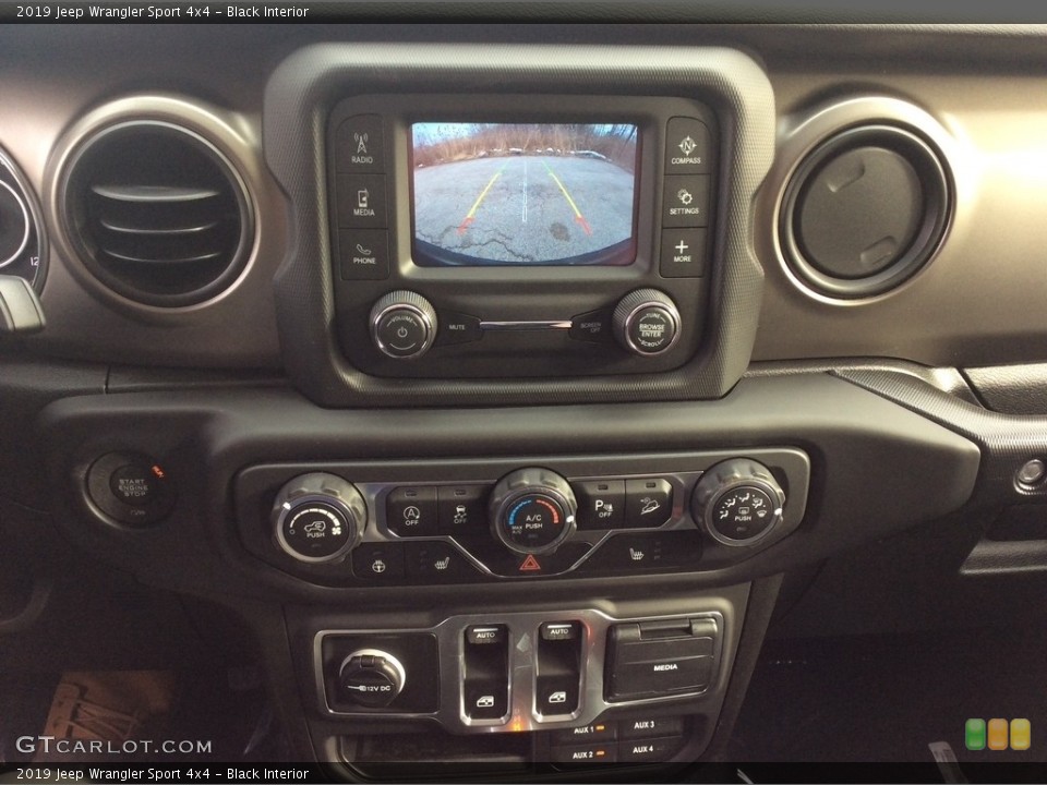 Black Interior Controls for the 2019 Jeep Wrangler Sport 4x4 #131049151