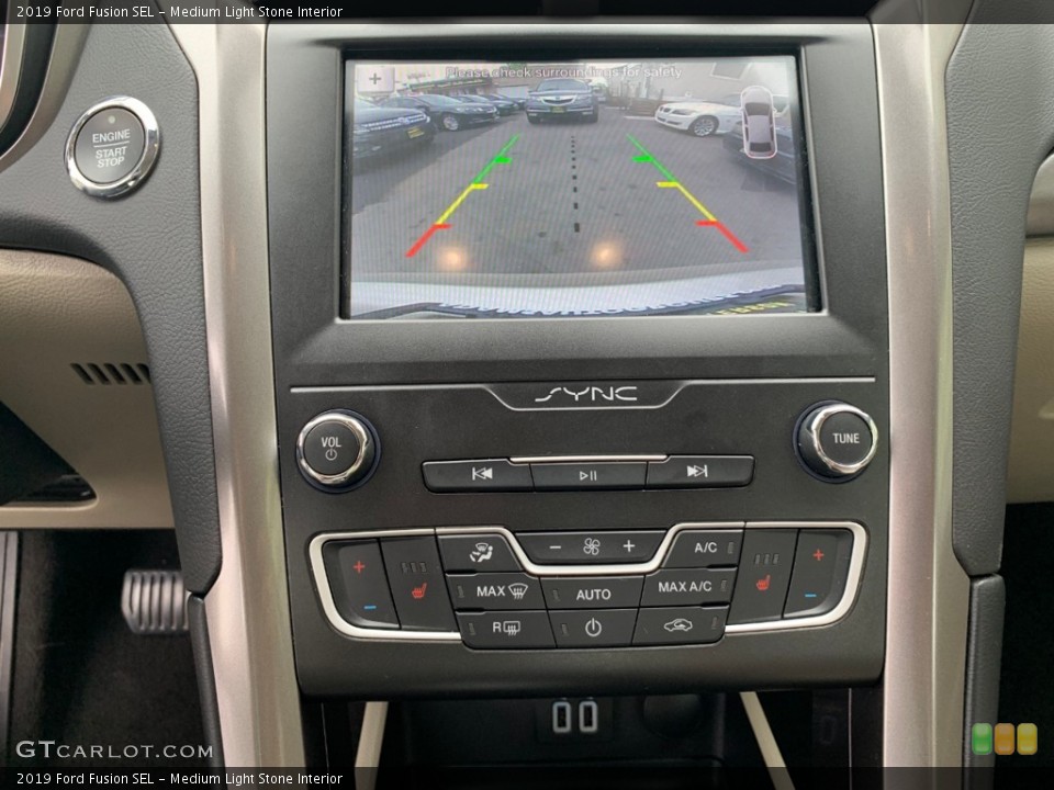 Medium Light Stone Interior Controls for the 2019 Ford Fusion SEL #133333796