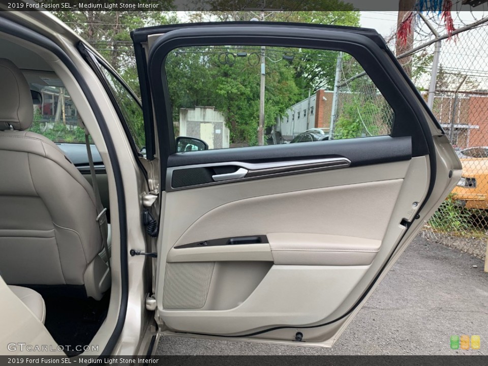 Medium Light Stone Interior Door Panel for the 2019 Ford Fusion SEL #133333997