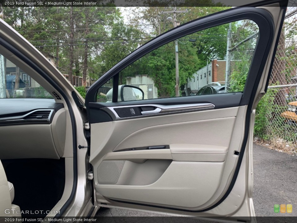 Medium Light Stone Interior Door Panel for the 2019 Ford Fusion SEL #133334036