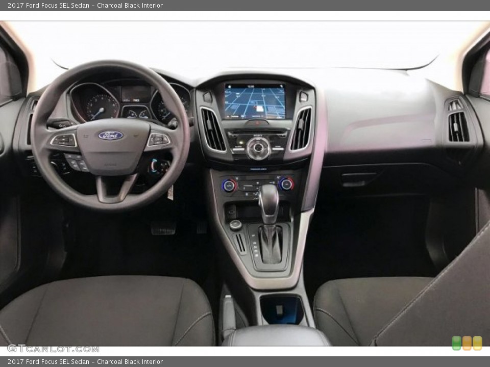 Charcoal Black Interior Dashboard for the 2017 Ford Focus SEL Sedan #134953865