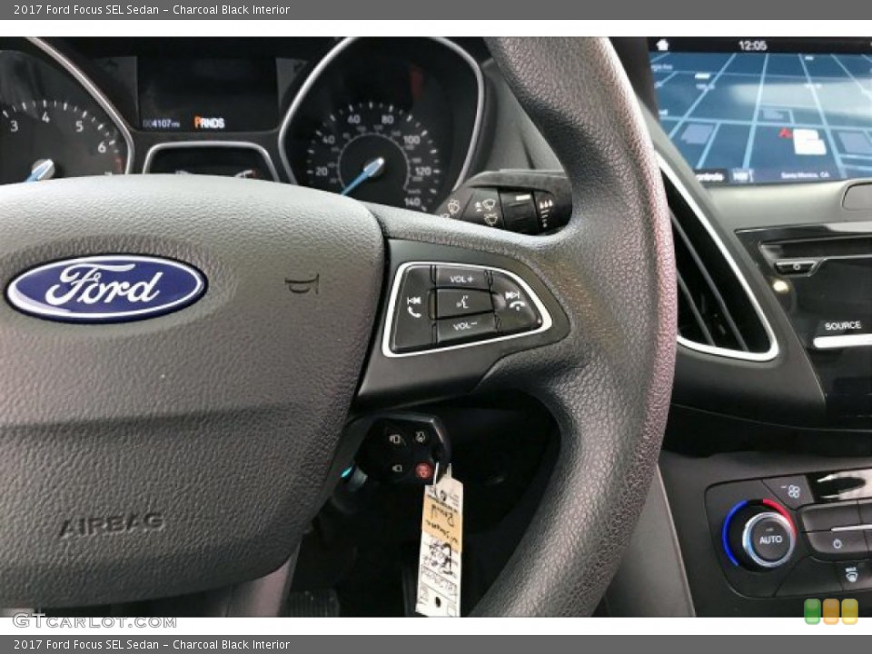 Charcoal Black Interior Steering Wheel for the 2017 Ford Focus SEL Sedan #134953919