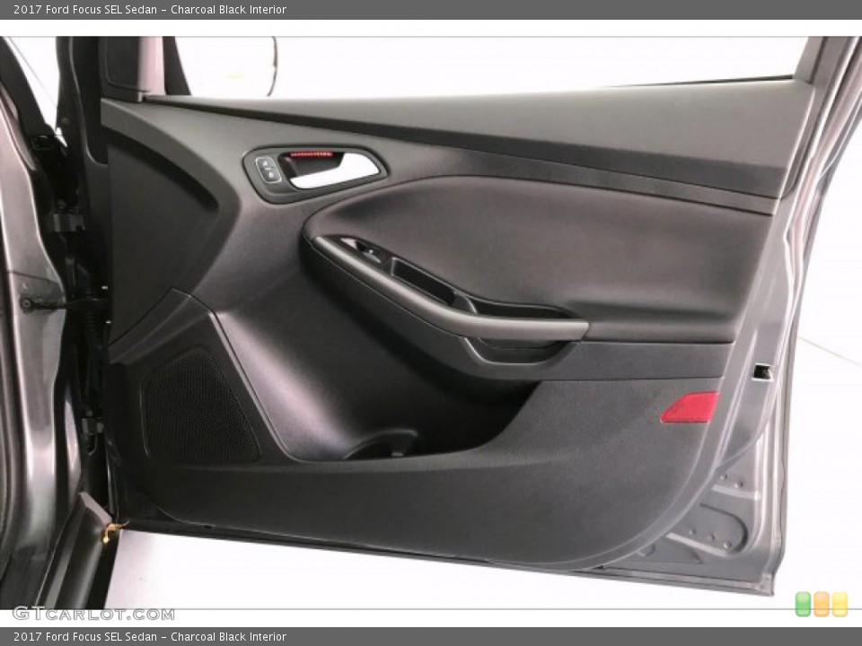 Charcoal Black Interior Door Panel for the 2017 Ford Focus SEL Sedan #134954201