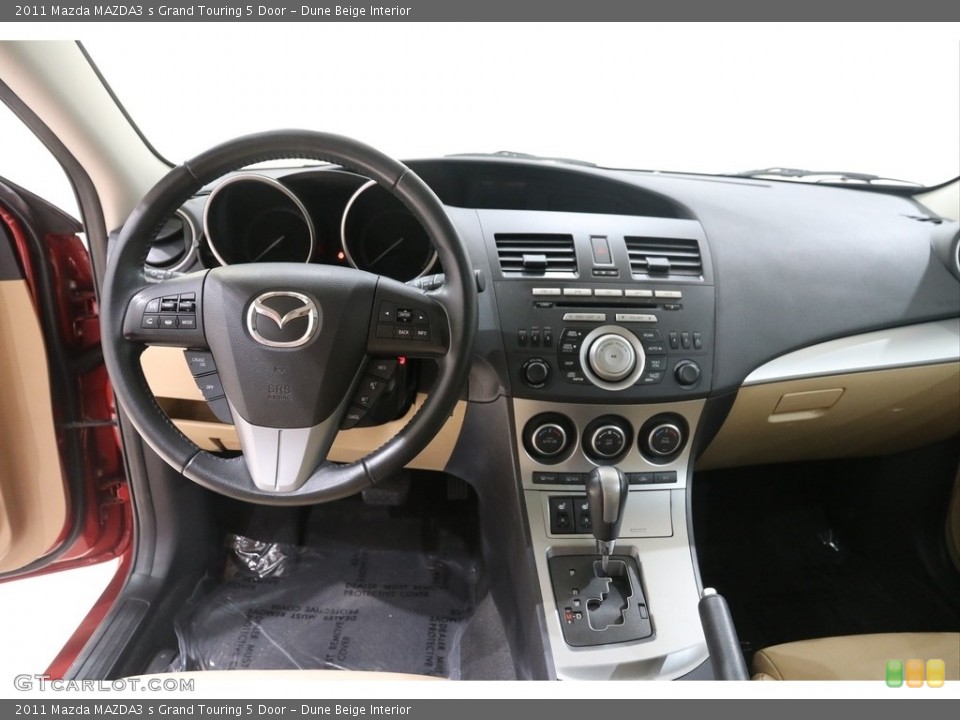 Dune Beige Interior Dashboard for the 2011 Mazda MAZDA3 s Grand Touring 5 Door #138194190
