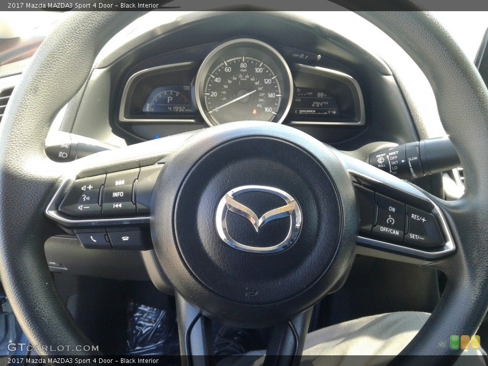 Black Interior Steering Wheel for the 2017 Mazda MAZDA3 Sport 4 Door #138249483