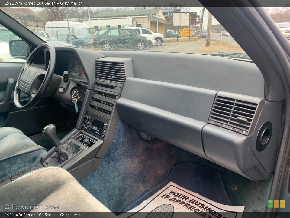 Grey Interior Dashboard for the 1991 Alfa Romeo 164 Sedan #138763296