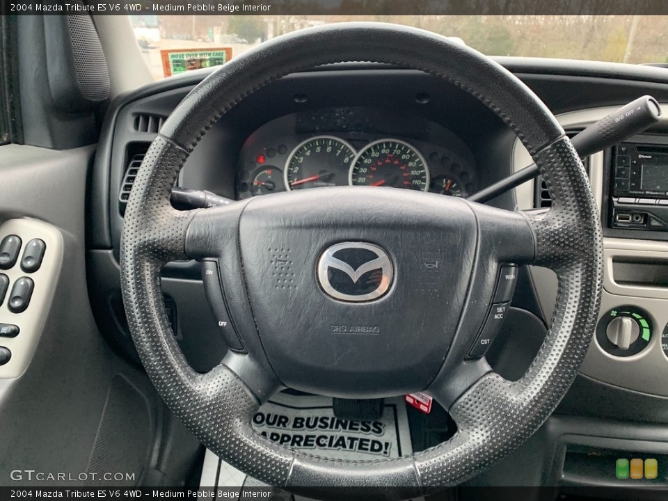 Medium Pebble Beige Interior Steering Wheel for the 2004 Mazda Tribute ES V6 4WD #138763569