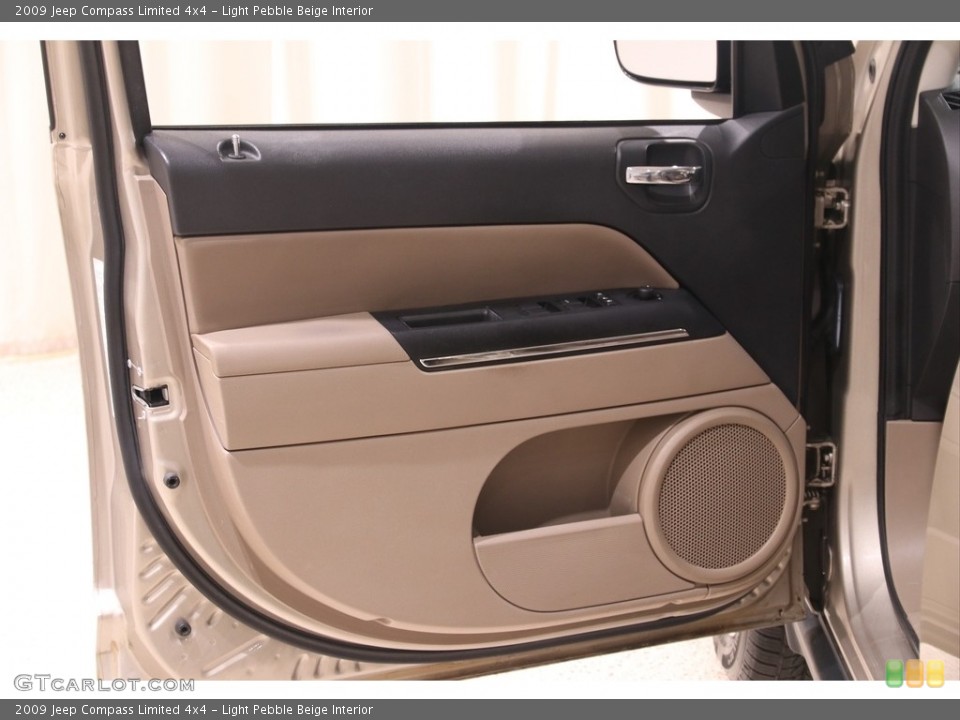 Light Pebble Beige Interior Door Panel for the 2009 Jeep Compass Limited 4x4 #139065786