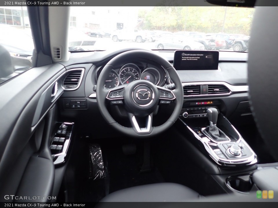Black Interior Dashboard for the 2021 Mazda CX-9 Touring AWD #139847007
