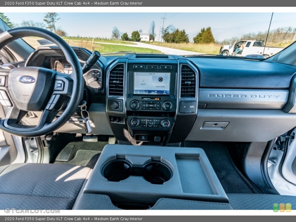 Medium Earth Gray Interior Dashboard for the 2020 Ford F350 Super Duty XLT Crew Cab 4x4 #140220445