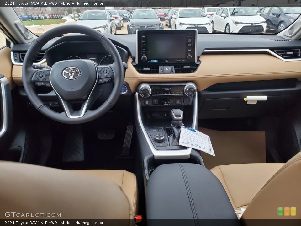 Nutmeg Interior Dashboard for the 2021 Toyota RAV4 XLE AWD Hybrid #140464375