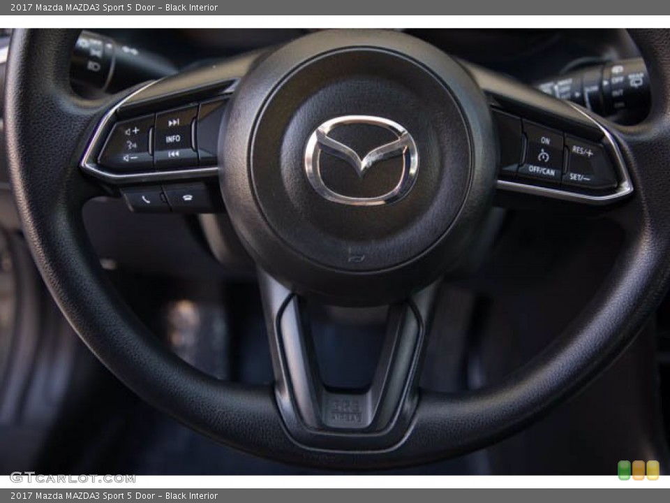 Black Interior Steering Wheel for the 2017 Mazda MAZDA3 Sport 5 Door #140475832