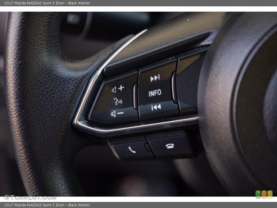 Black Interior Steering Wheel for the 2017 Mazda MAZDA3 Sport 5 Door #140475839