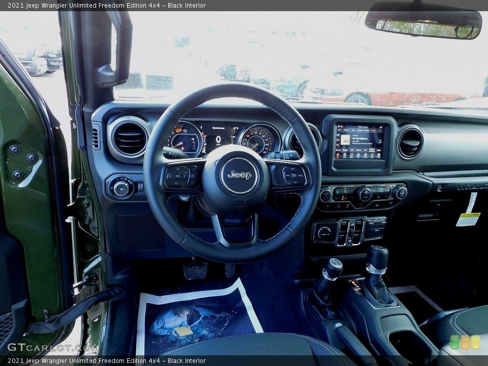 Black Interior Dashboard for the 2021 Jeep Wrangler Unlimited Freedom Edition 4x4 #140810429