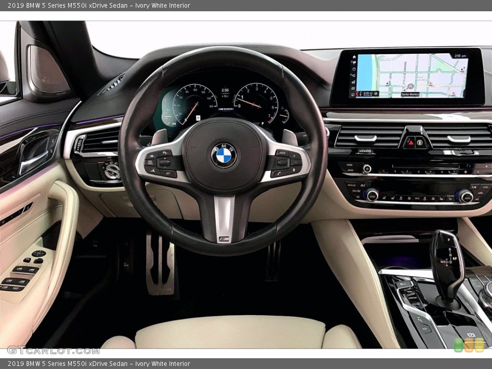 Ivory White Interior Dashboard for the 2019 BMW 5 Series M550i xDrive Sedan #141216118