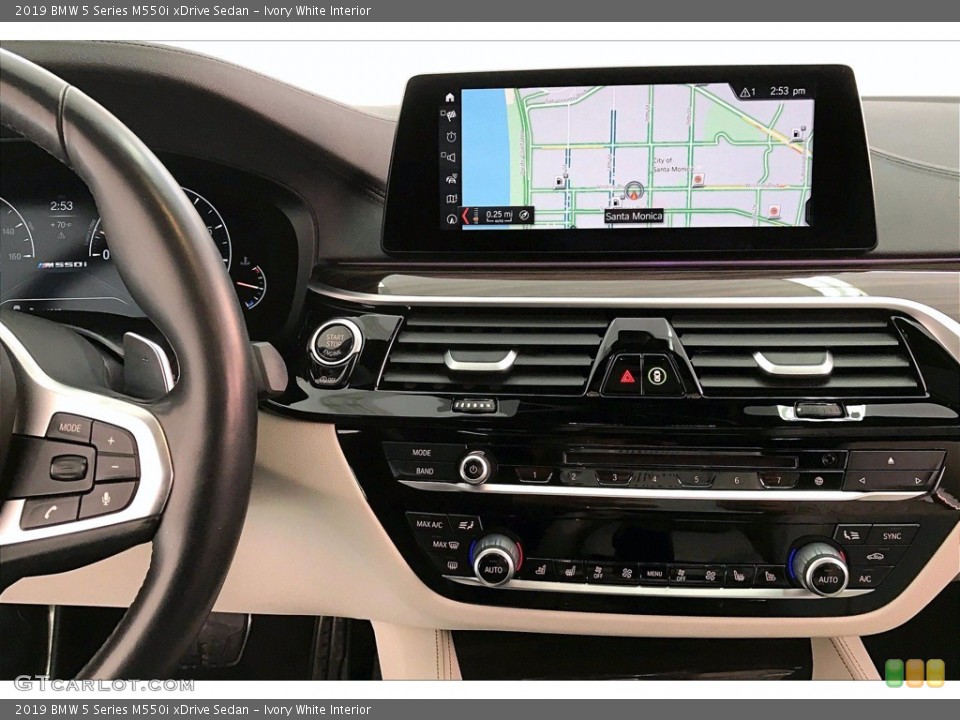 Ivory White Interior Controls for the 2019 BMW 5 Series M550i xDrive Sedan #141216142