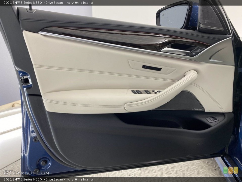 Ivory White Interior Door Panel for the 2021 BMW 5 Series M550i xDrive Sedan #141786344