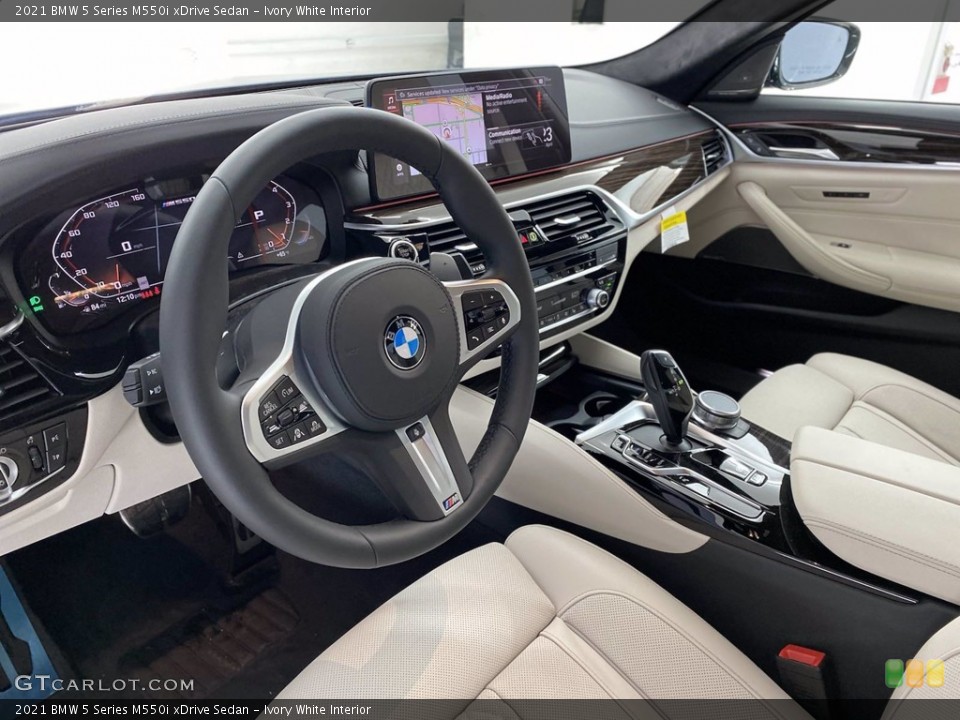 Ivory White Interior Photo for the 2021 BMW 5 Series M550i xDrive Sedan #141786374