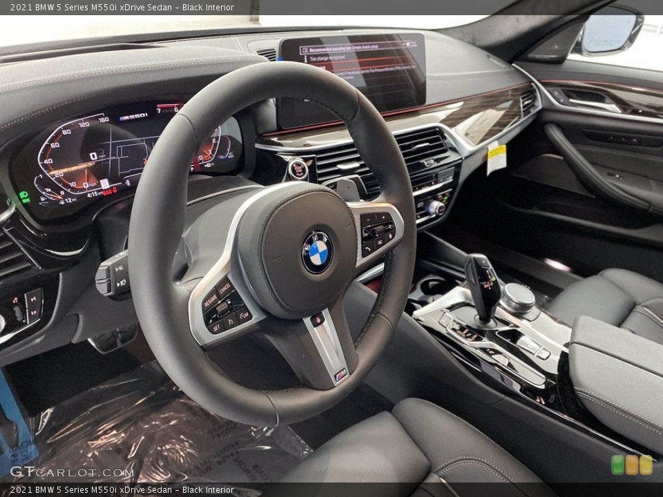 Black Interior Steering Wheel for the 2021 BMW 5 Series M550i xDrive Sedan #141812053