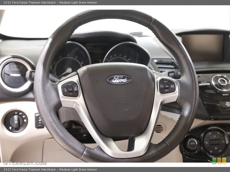 Medium Light Stone Interior Steering Wheel for the 2015 Ford Fiesta Titanium Hatchback #141971043