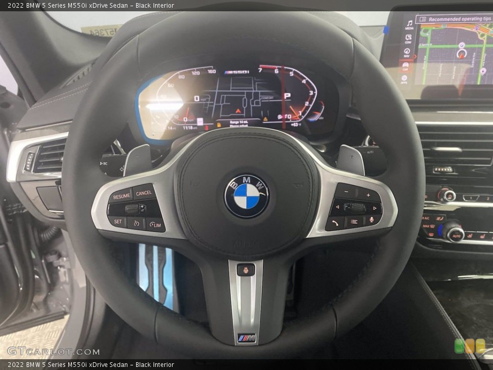 Black Interior Steering Wheel for the 2022 BMW 5 Series M550i xDrive Sedan #143747612