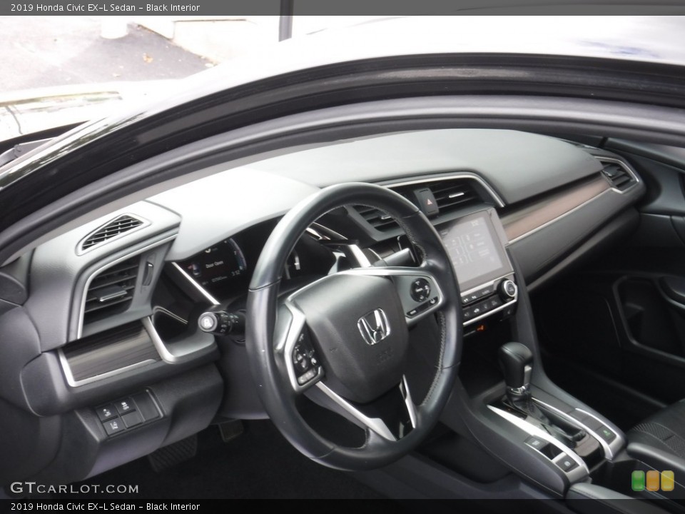 Black Interior Dashboard for the 2019 Honda Civic EX-L Sedan #144914620