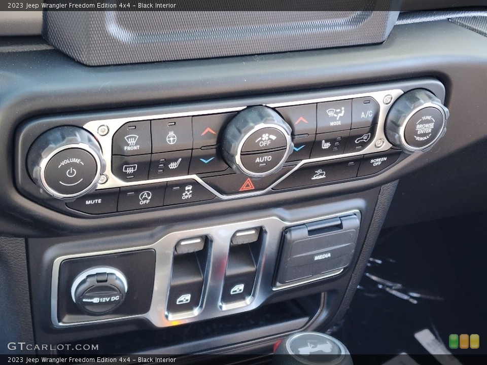 Black Interior Controls for the 2023 Jeep Wrangler Freedom Edition 4x4 #145060589