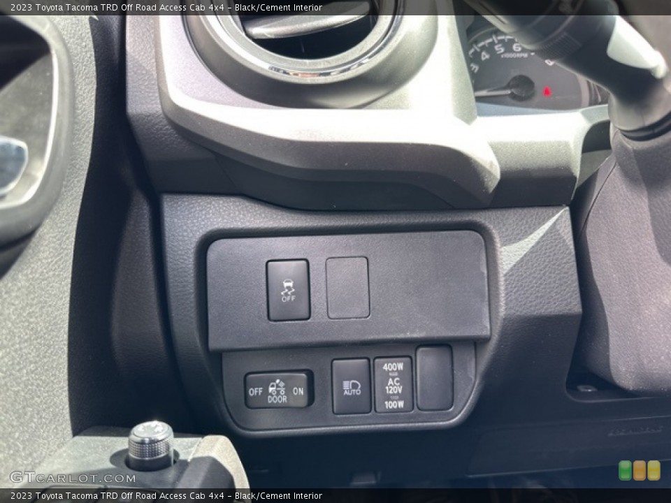 Black/Cement Interior Controls for the 2023 Toyota Tacoma TRD Off Road Access Cab 4x4 #146097255