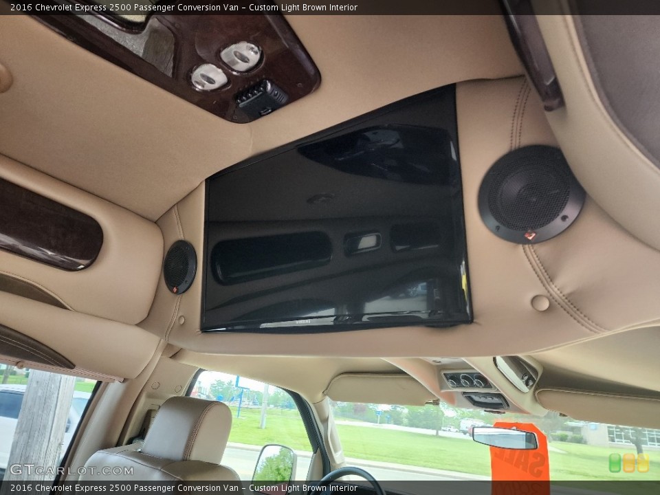 Custom Light Brown Interior Entertainment System for the 2016 Chevrolet Express 2500 Passenger Conversion Van #146124179