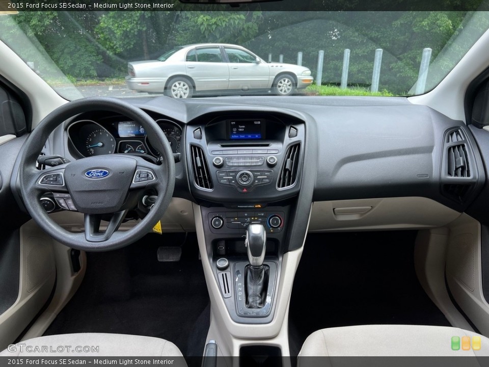 Medium Light Stone Interior Dashboard for the 2015 Ford Focus SE Sedan #146148636