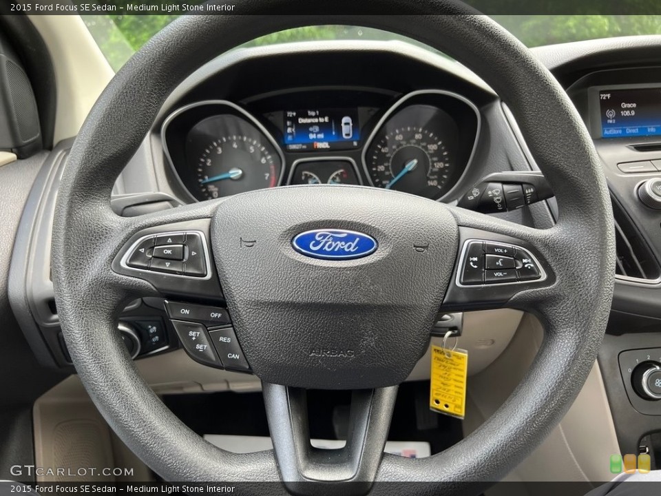 Medium Light Stone Interior Steering Wheel for the 2015 Ford Focus SE Sedan #146148666