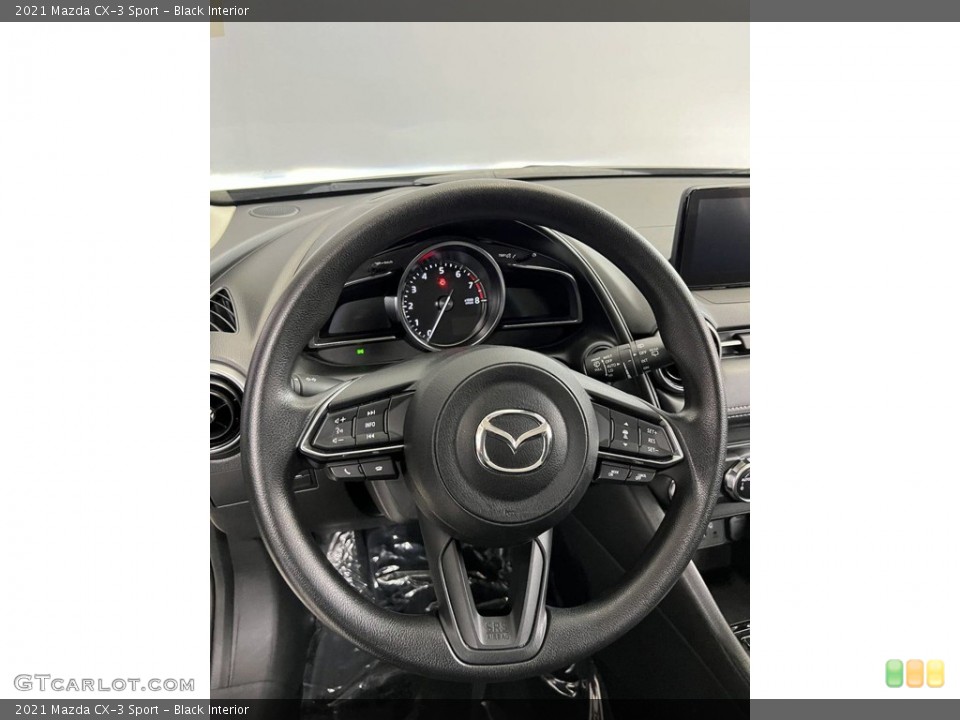 Black Interior Steering Wheel for the 2021 Mazda CX-3 Sport #146234046
