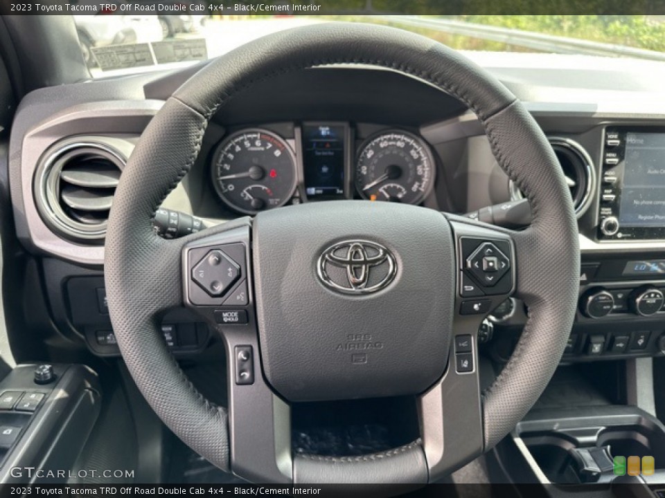 Black/Cement Interior Steering Wheel for the 2023 Toyota Tacoma TRD Off Road Double Cab 4x4 #146442778