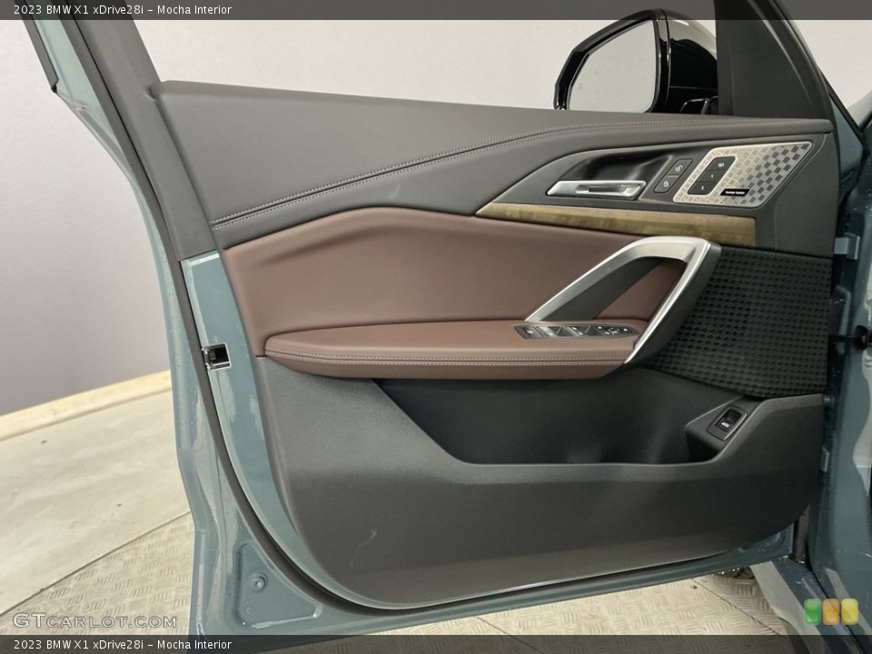 Mocha Interior Door Panel for the 2023 BMW X1 xDrive28i #146569612