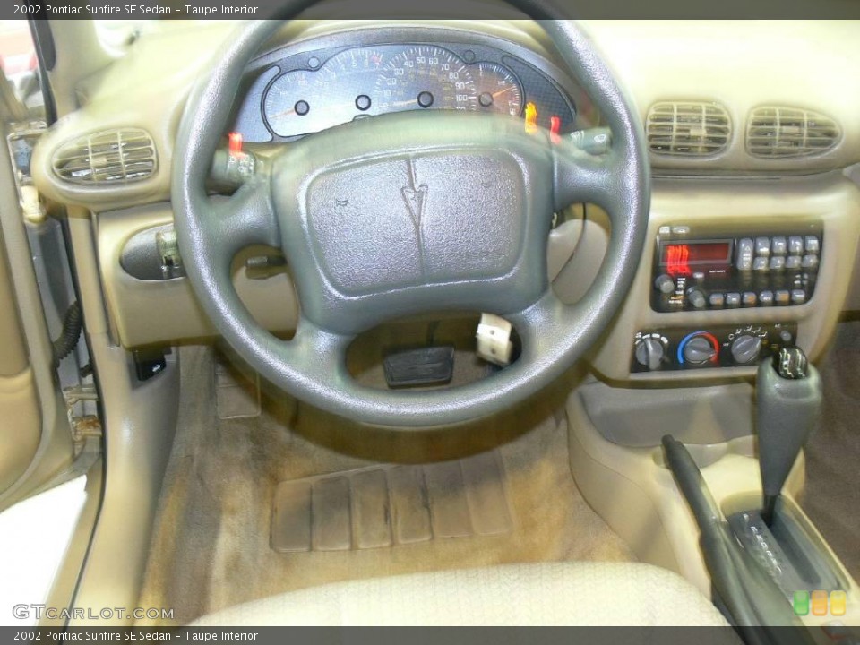 Taupe Interior Steering Wheel for the 2002 Pontiac Sunfire SE Sedan #23671420