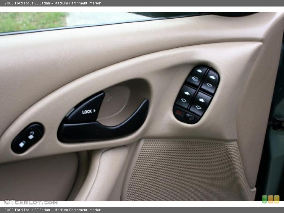 Medium Parchment Interior Controls for the 2003 Ford Focus SE Sedan #28627992