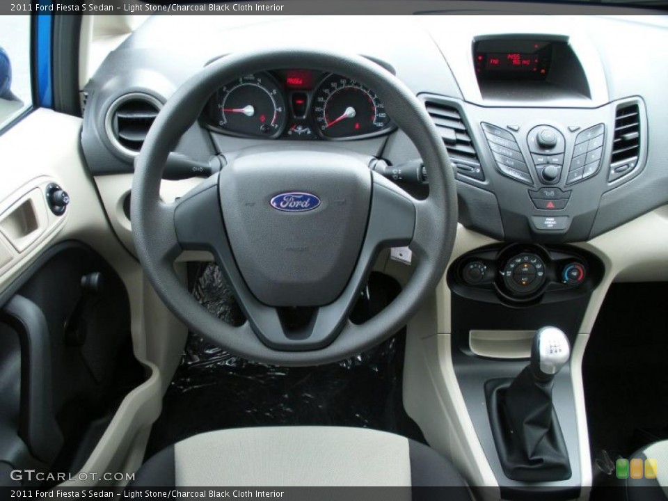 Light Stone/Charcoal Black Cloth Interior Steering Wheel for the 2011 Ford Fiesta S Sedan #37308677