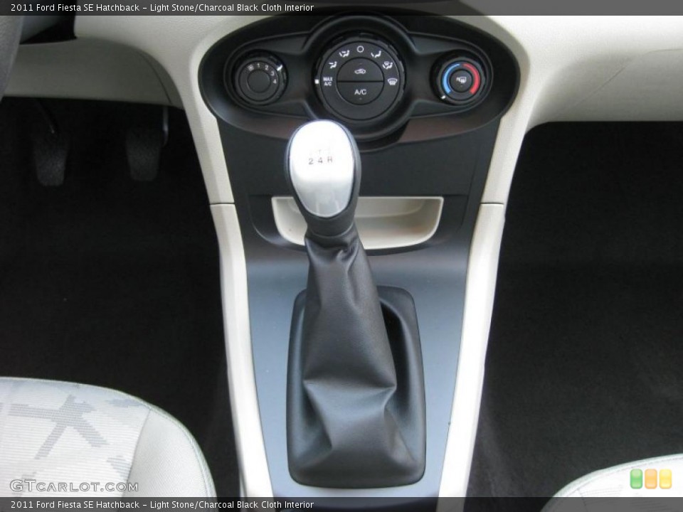 Light Stone/Charcoal Black Cloth Interior Transmission for the 2011 Ford Fiesta SE Hatchback #37889688