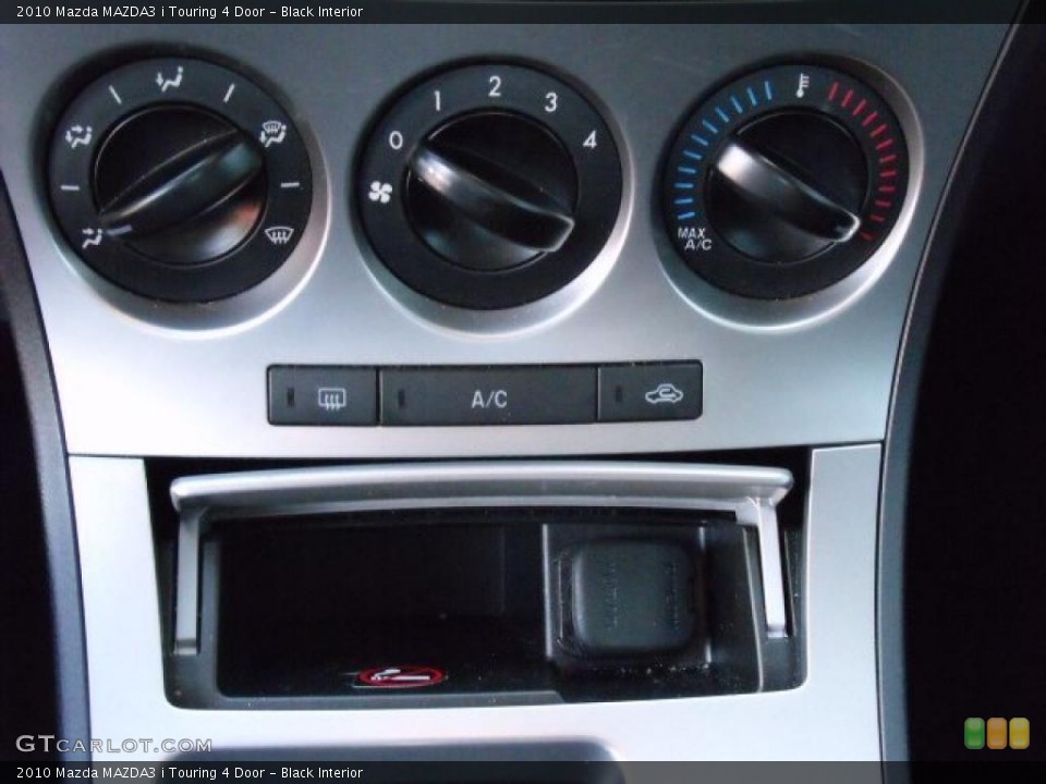 Black Interior Controls for the 2010 Mazda MAZDA3 i Touring 4 Door #37921686