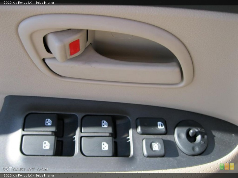 Beige Interior Controls for the 2010 Kia Rondo LX #37935694