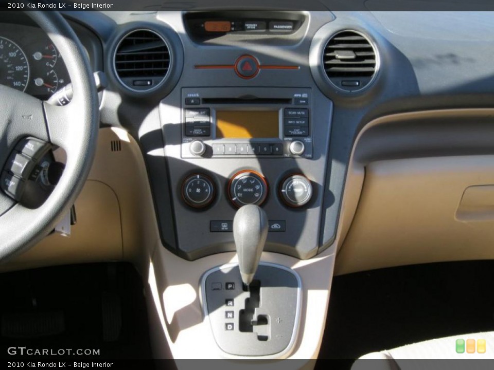 Beige Interior Controls for the 2010 Kia Rondo LX #37935718