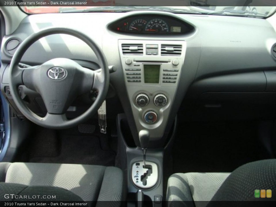Dark Charcoal Interior Dashboard for the 2010 Toyota Yaris Sedan #38023508