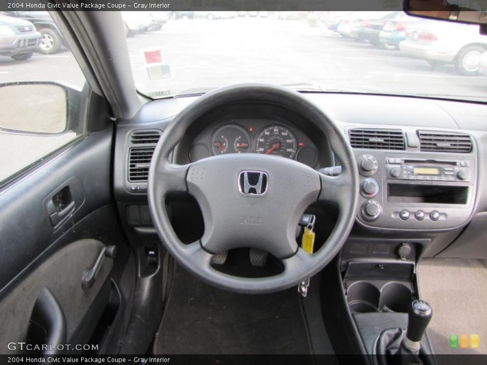 Gray Interior Dashboard for the 2004 Honda Civic Value Package Coupe #38086787