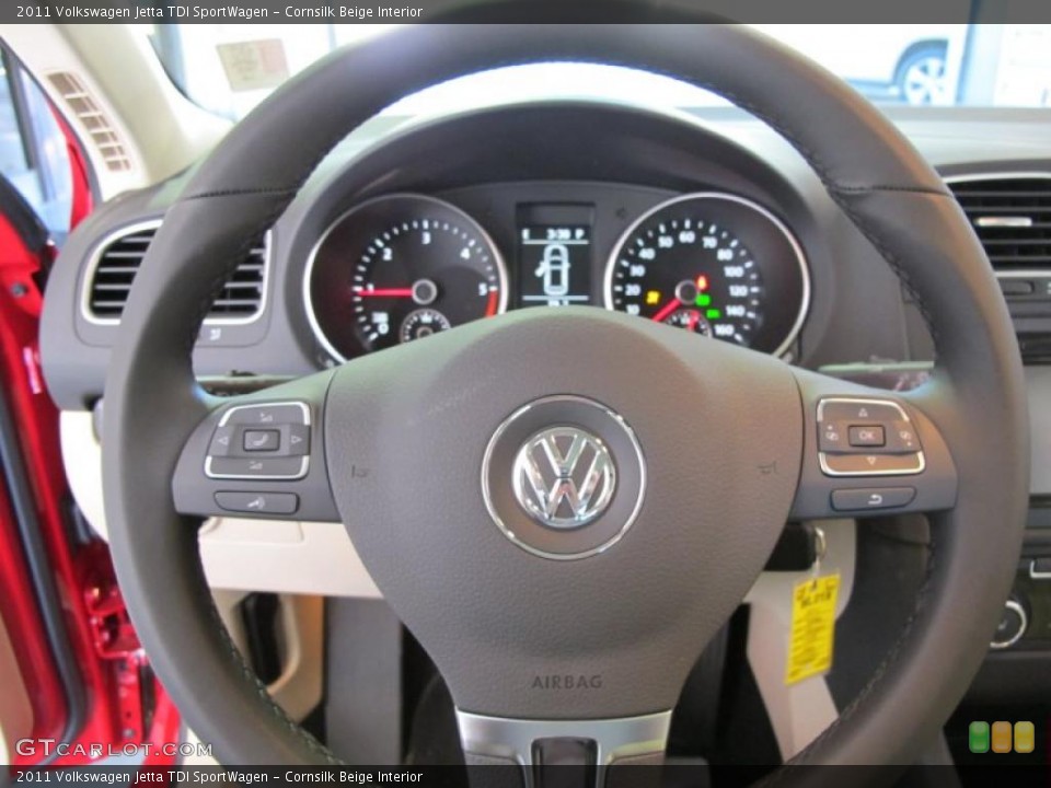 Cornsilk Beige Interior Steering Wheel for the 2011 Volkswagen Jetta TDI SportWagen #38090335