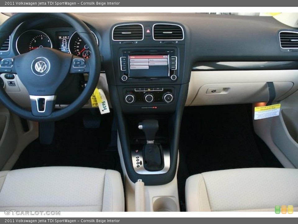 Cornsilk Beige Interior Dashboard for the 2011 Volkswagen Jetta TDI SportWagen #38148083