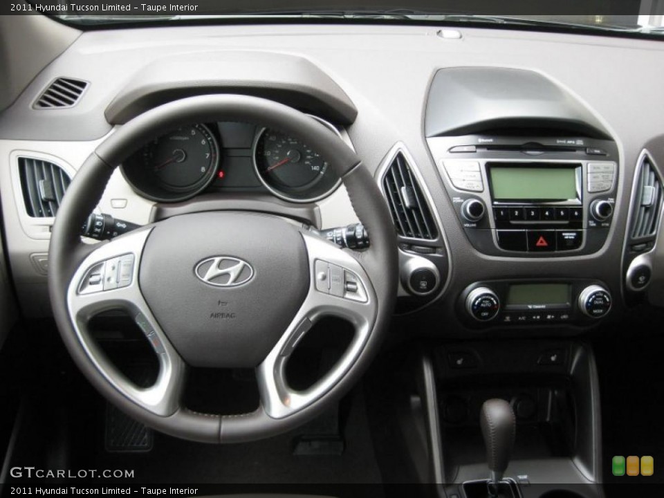 Taupe Interior Dashboard for the 2011 Hyundai Tucson Limited #38214108