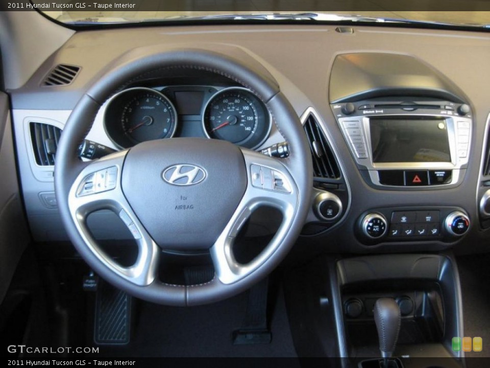 Taupe Interior Dashboard for the 2011 Hyundai Tucson GLS #38215096