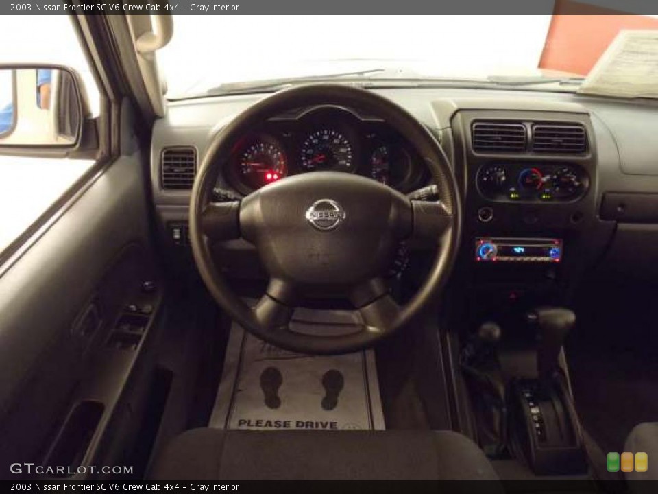 Gray Interior Dashboard for the 2003 Nissan Frontier SC V6 Crew Cab 4x4 #38343137