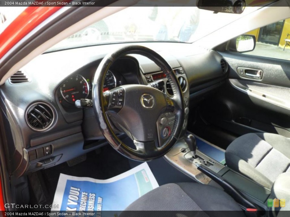 Black Interior Dashboard for the 2004 Mazda MAZDA6 i Sport Sedan #38392840